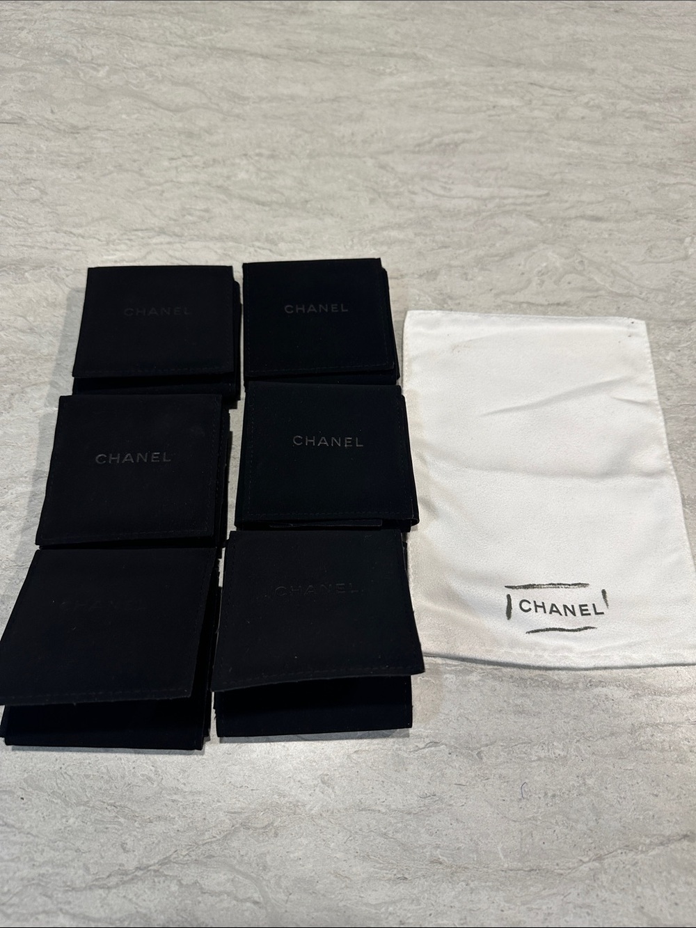 6 CHANEL Black Velvet Pouches And White Cloth